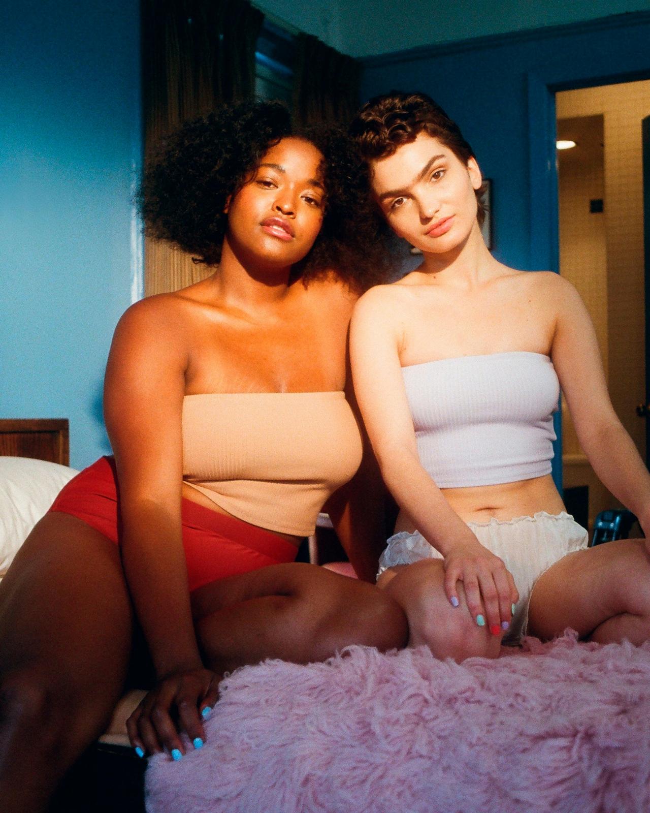 Two women side by side, celebrating love and identity